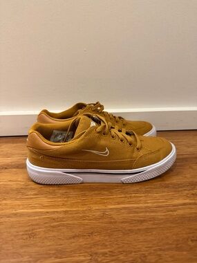 Nike Low-Top Sneakers in Mustard/Gold with White Swoosh
